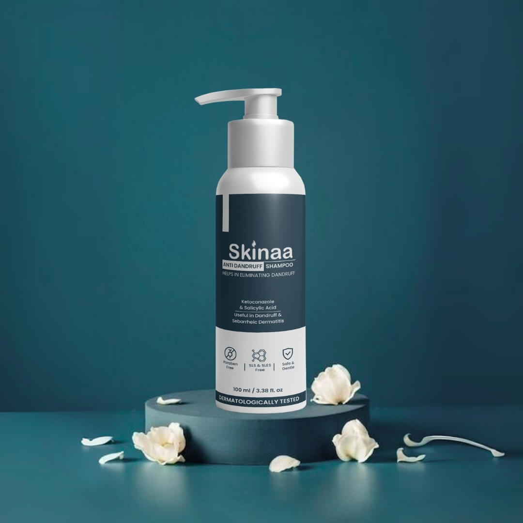 Skinaa Anti-Dandruff Shampoo with climbazole, piroctone olamine, and aloe vera extract for dandruff control, displayed on a floral background